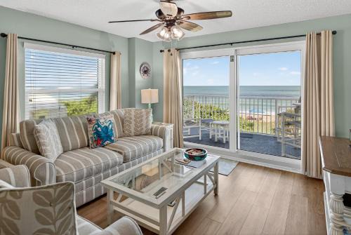 Seawinds Condo Apartment | Direct oceanfront 2/2 corner condo with large balcony, heated pool, and garage parking