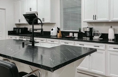 Roseville House | A3- Comfortable queen bedroom in Roseville with TV and desk