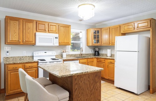 Colington Harbour House | Canal front Retreat with Kayaks, Paddle boards and Fire pit. Newly Furnished!