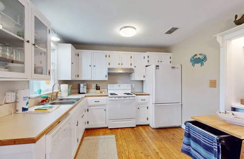 Colington Harbour House | Charming retreat with waterfront views, beach access, pool, & private hot tub