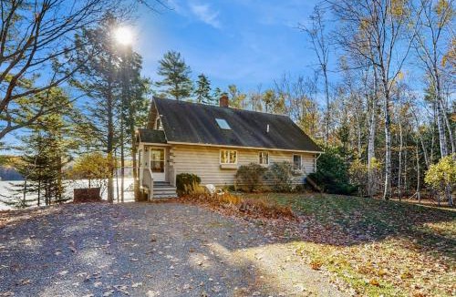 Wiscasset House | Charming riverfront home with cozy interiors, dock, and scenic deck views