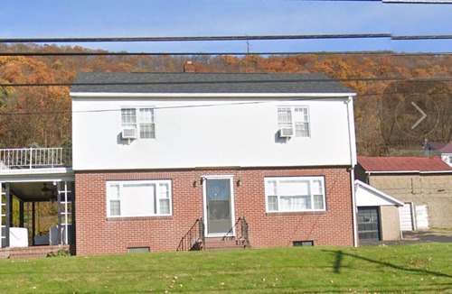 Gowen City House | Gather Inn is a charming house with a sauna, a theater, and a game room.