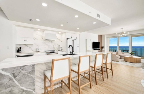 Thomas Drive Condo | Luxurious renovated Gulf-front condo with complimentary Beach Chair Service!