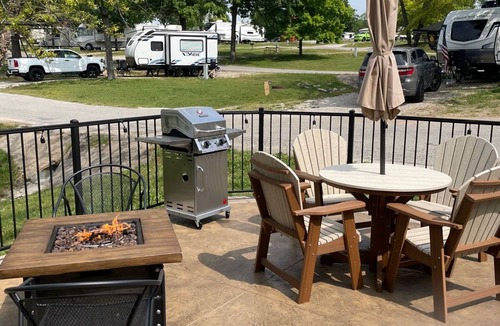 Branson Cottage | Oregon Trail Wagon has two queens size bed, bathroom w/shower, heat & a/c, smart tv, wi-fi, microwa