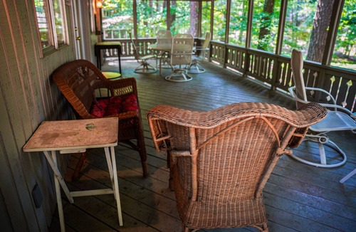 Pine Mountain Ski Chalet | Relax on your screened in porch in this pet friendly chalet!