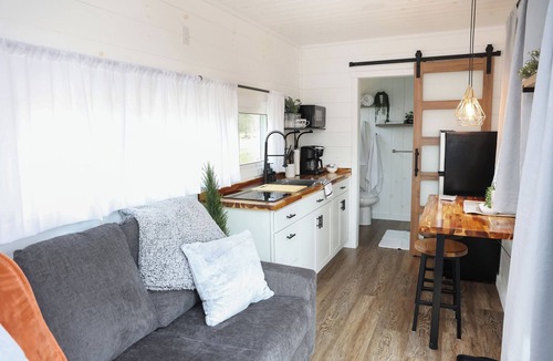 Mingoville Cabin | The Bellefonte Campground presents: The Luxury Hideaway Container Home, hot tub, Rooftop veranda, and more.