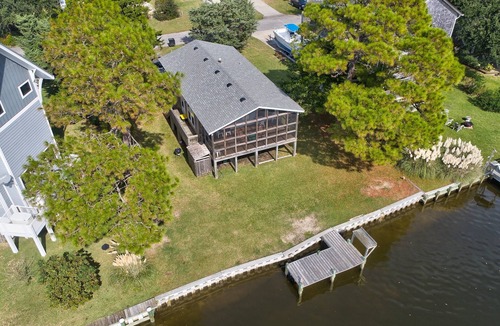 Brigands' Bay House | Waterfront home on a scenic canal with a dock, screened porch & fast WiFi