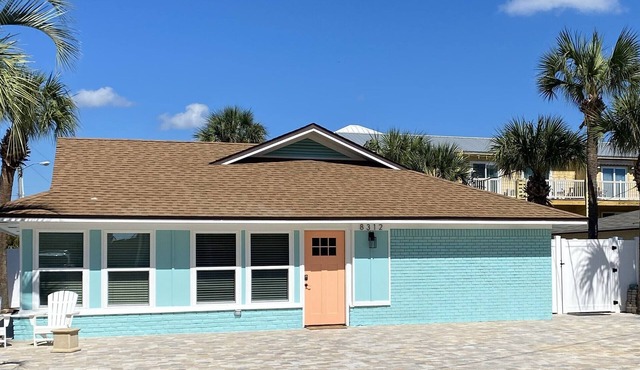 Completely updated home directly across from the Beach with pool and hot tub